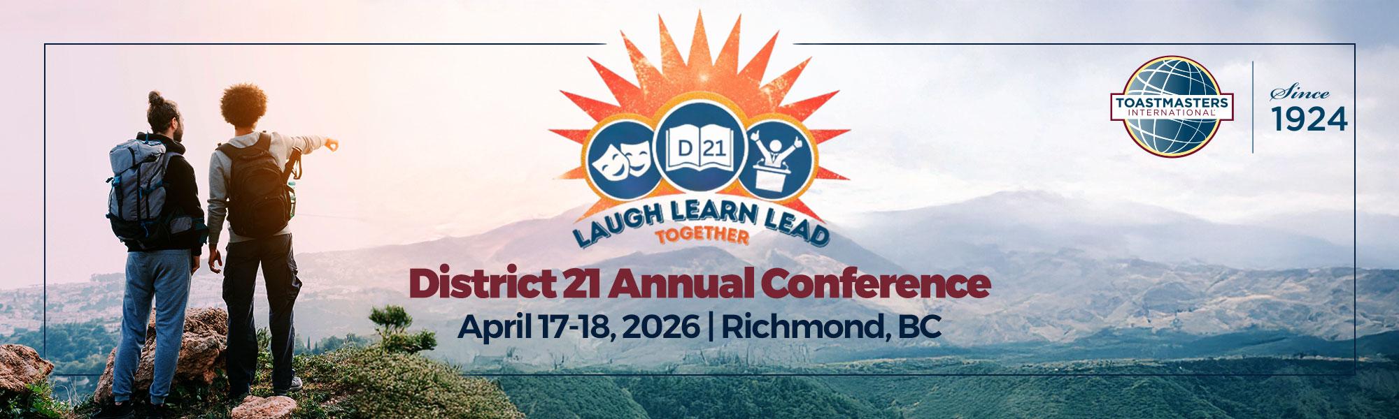 Two hikers stand on a hill looking towards a valley. Text "District 21 Annual Conference 2026"  April 17 - 18, 2026